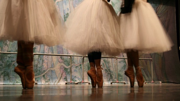 From below, the costumes and pointe shoes look like those any other ballet company. 